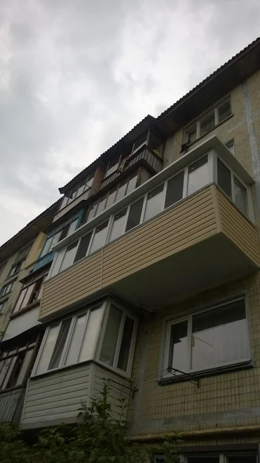 Фото Остекление, обшивка с наружи и розширение  балкона 
