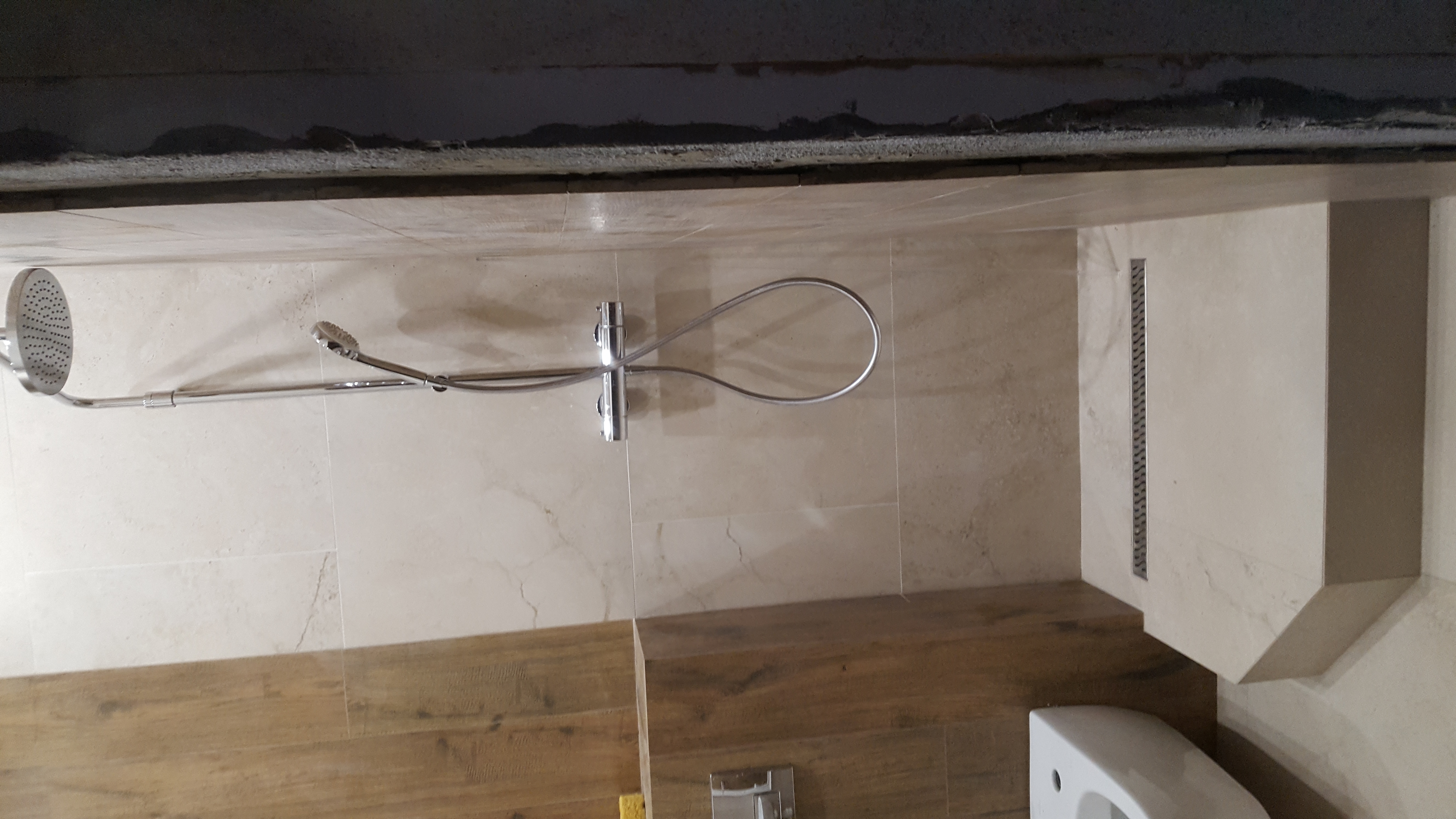 Фото Штукатурні роботи, облаштування душового піддону, укладання плитки, установка сантехніки.