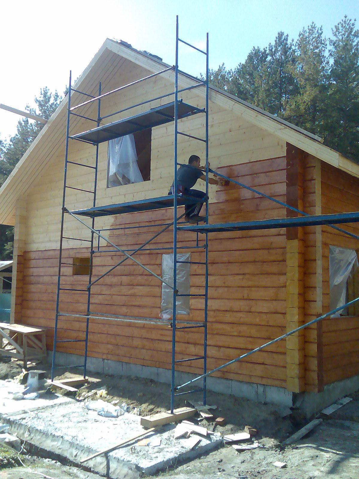 Фото Покрытие лаком домов, бань, балконов из древесины 2